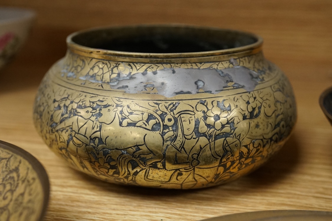 A group of Islamic and Indian brass bowls, largest 15cm in diameter